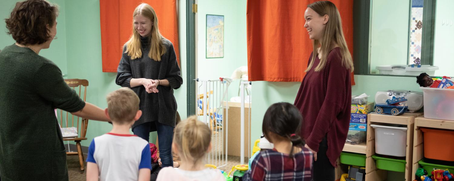 Students in the SPU's School of Education work with young children in a classroom.